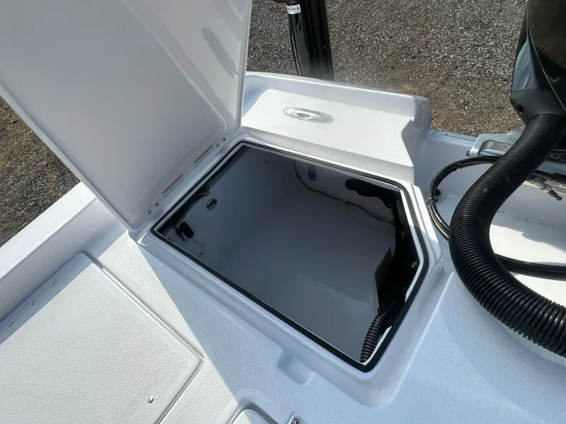 Slide: The Image of Open storage compartment on 2026 Action Craft 24 Bay boat, showcasing interior space. - 34