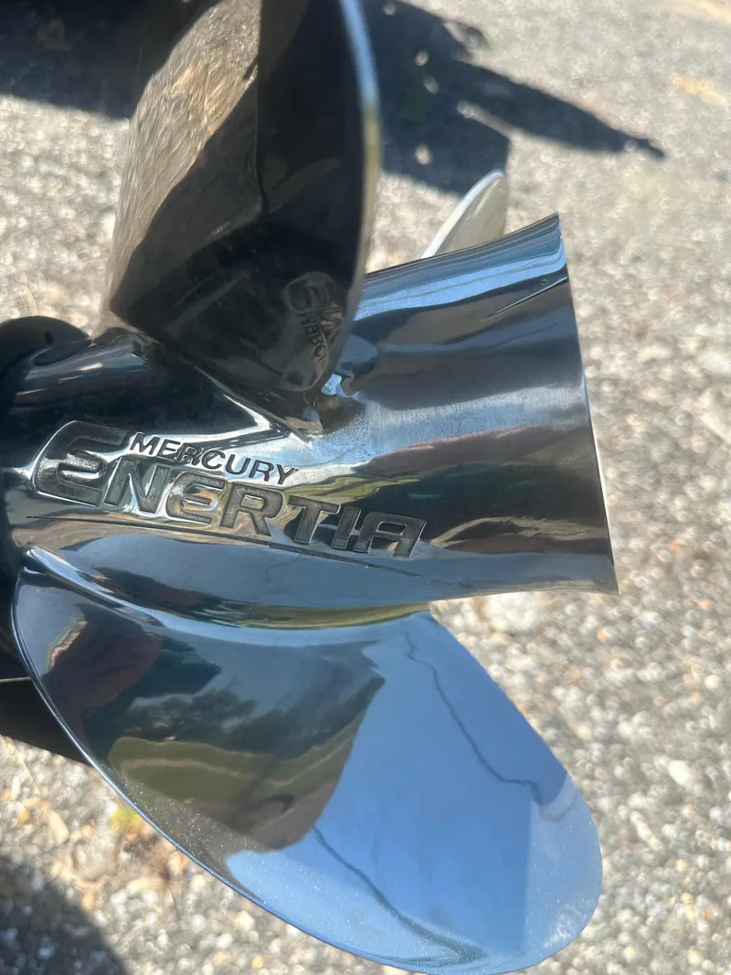 Slide: The Image of Close-up of a Mercury Enertia propeller on a 2026 Action Craft 24 Bay boat. - 37