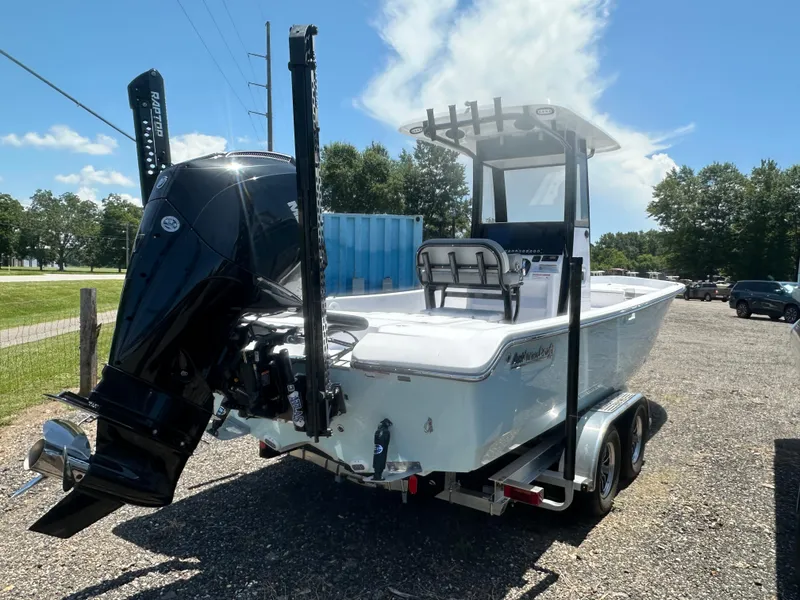 Slide: The Image of 2026 Action Craft 24 Bay boat on trailer, featuring powerful outboard motor. - 9