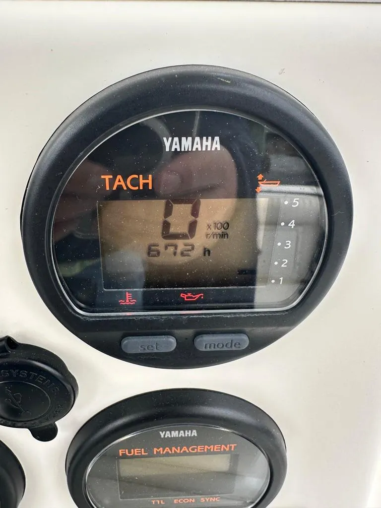 Slide: The Image of Yamaha tachometer display on 2005 Regulator 26 Forward Seating boat dashboard. - 7