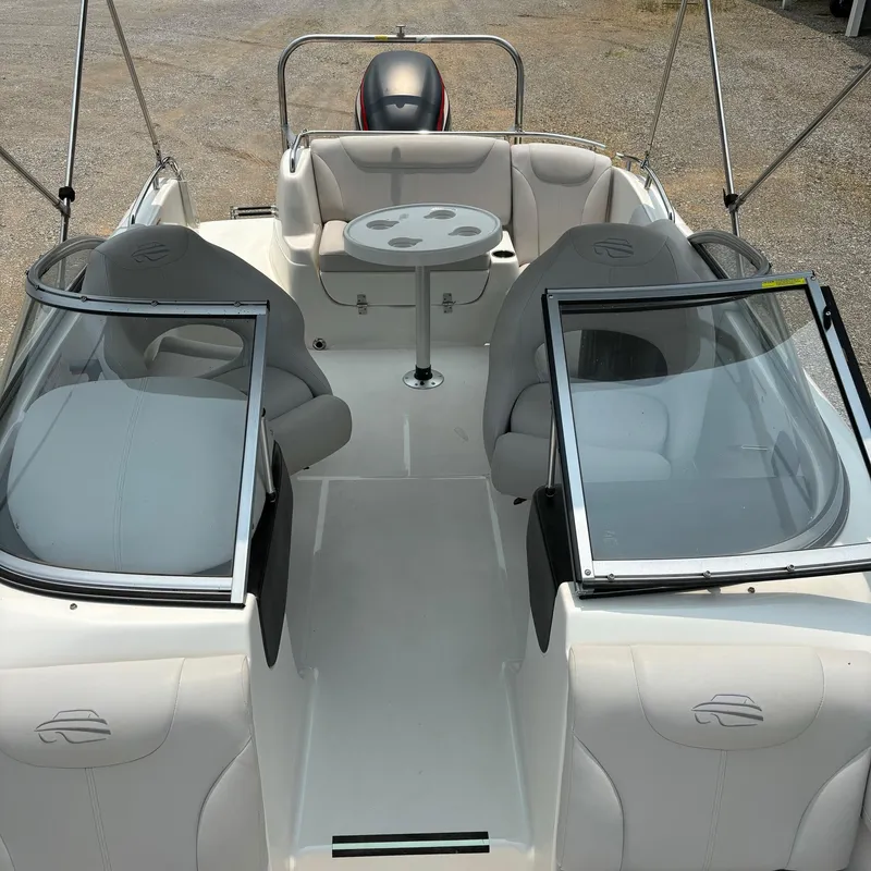 Slide: The Image of 2020 Splendor Odyssey 220 boat interior with seating and table, featuring modern design elements. - 4