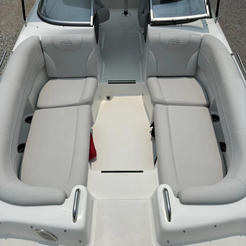 Slide: The Image of 2020 Splendor Odyssey 220 boat interior with gray seating and open deck layout. - 5