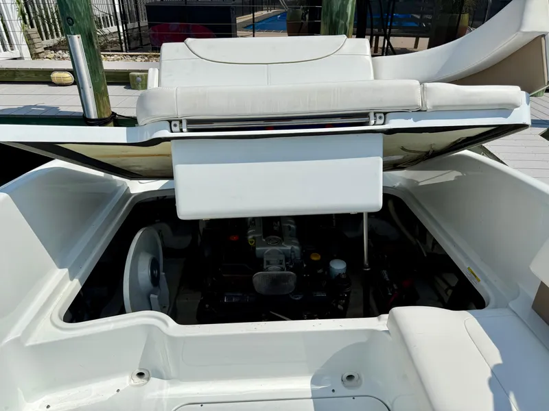Slide: The Image of 2011 Formula 270 Bowrider engine compartment with open hatch, showcasing interior components. - 13