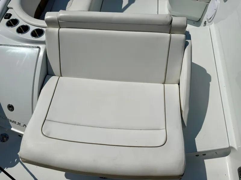 Slide: The Image of 2011 Formula 270 Bowrider boat seat, white upholstery, cup holders visible. - 14