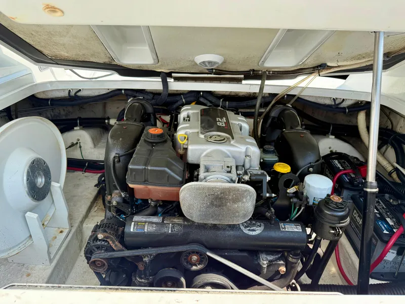 Slide: The Image of Engine compartment of a 2011 Formula 270 Bowrider boat, showcasing the engine and components. - 3