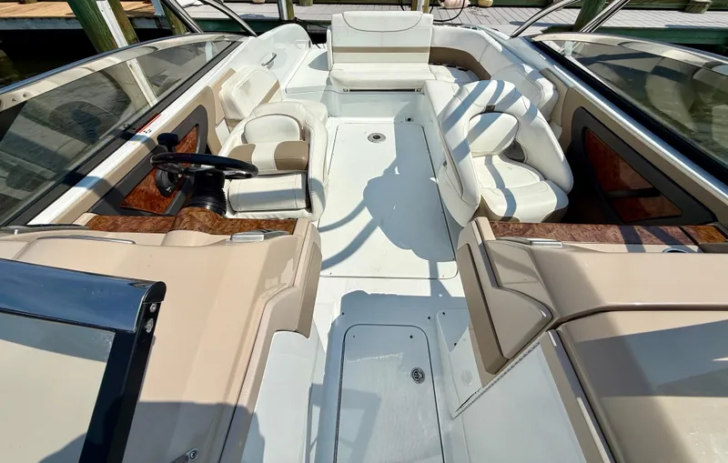 Slide: The Image of 2011 Formula 270 Bowrider interior with white seating and sleek design. - 6