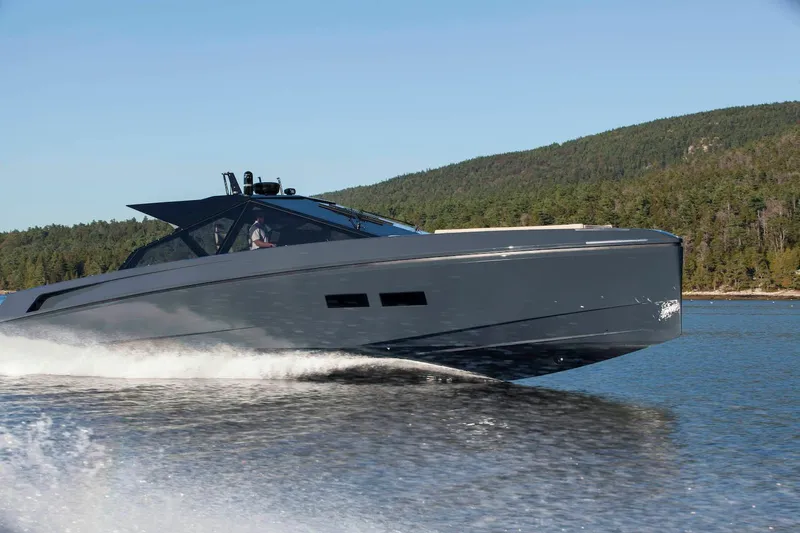 The Image of 2016 Wally Wallypower 52 yacht cruising on a serene lake with forested hills. - 0
