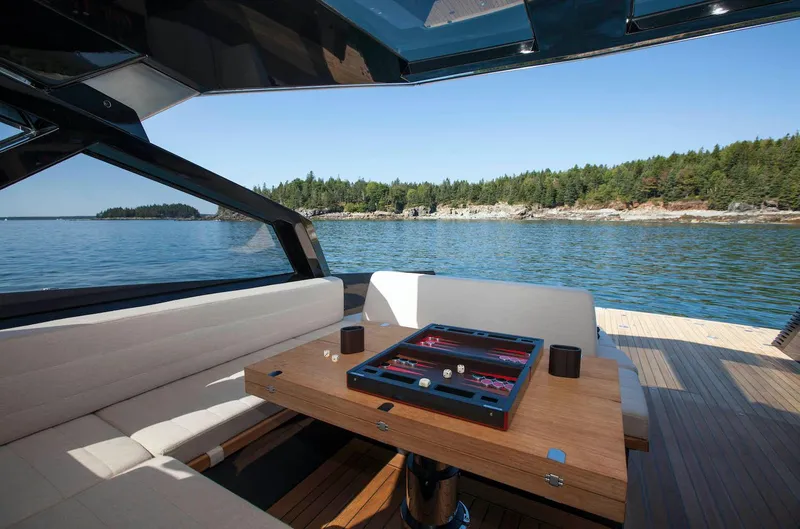 Slide: The Image of Luxurious 2016 Wally Wallypower 52 yacht interior with backgammon table, scenic ocean view. - 17