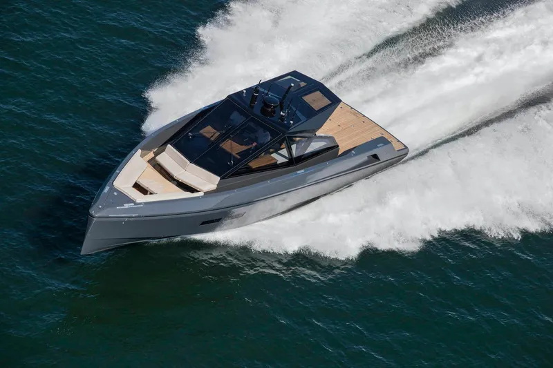 Slide: The Image of Sleek 2016 Wally Wallypower 52 yacht cruising swiftly on open water. - 2