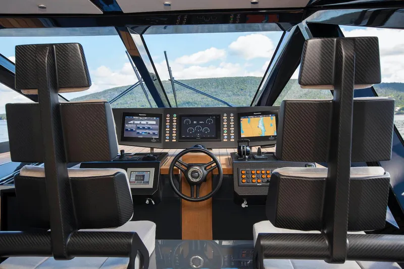 Slide: The Image of Cockpit of 2016 Wally Wallypower 52 yacht with modern navigation controls and carbon fiber seats. - 20
