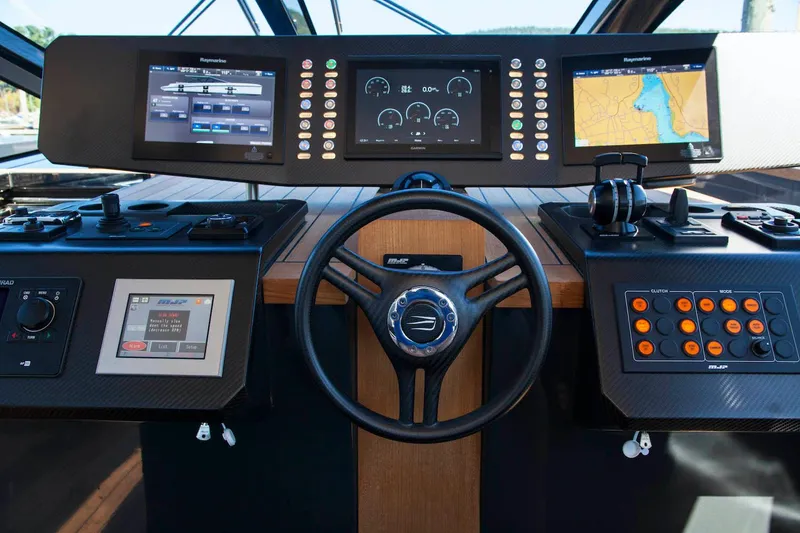 Slide: The Image of Cockpit of 2016 Wally Wallypower 52 yacht with advanced navigation controls and displays. - 21