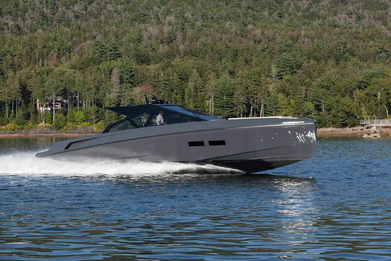 Slide: The Image of Wallypower 52 yacht cruising on a lake, surrounded by lush forest, 2016 model. - 7
