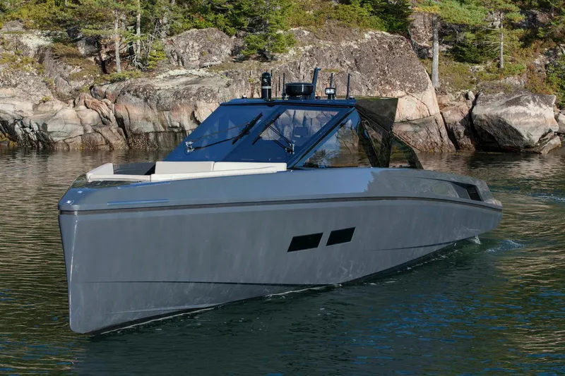 Slide: The Image of 2016 Wally Wallypower 52 yacht cruising near rocky shoreline. - 9