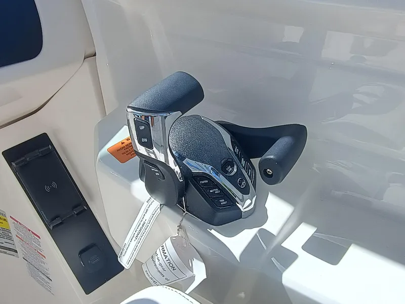 Slide: The Image of Throttle controls of a 2025 Robalo R257 Dual Console boat. - 17