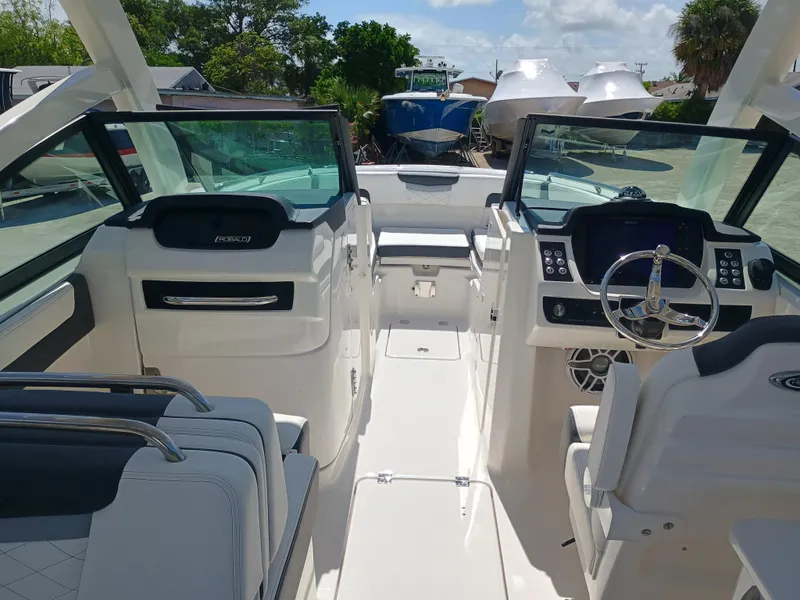 Slide: The Image of 2025 Robalo R257 Dual Console boat interior with modern dashboard and seating. - 28