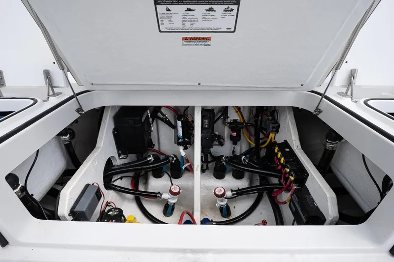 Slide: The Image of 2026 Blackfin 262 HB boat engine compartment with wiring and components visible. - 11