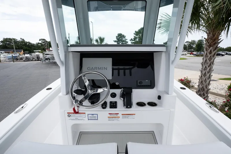 Slide: The Image of 2026 Blackfin 262 HB boat helm with Garmin navigation system and steering wheel. - 15