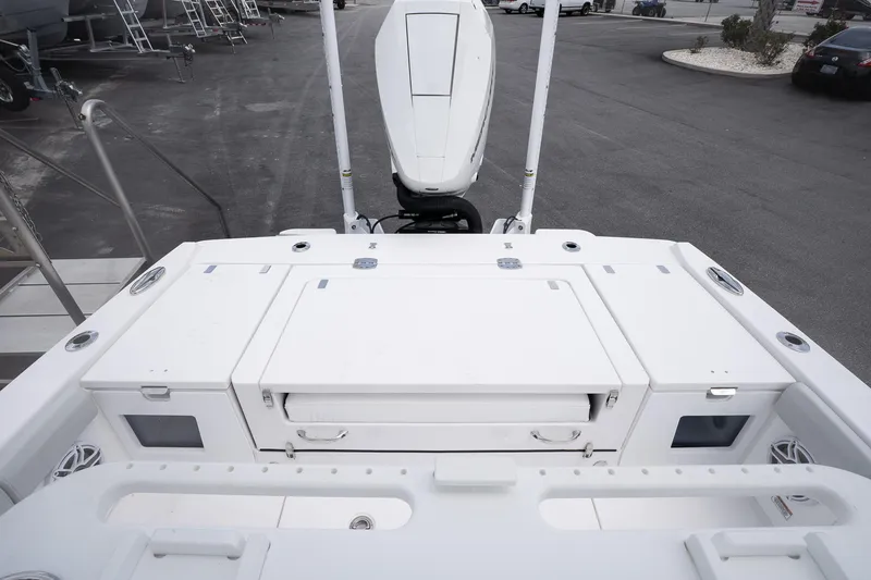 Slide: The Image of 2026 Blackfin 262 HB boat deck with storage compartments and outboard motor. - 7