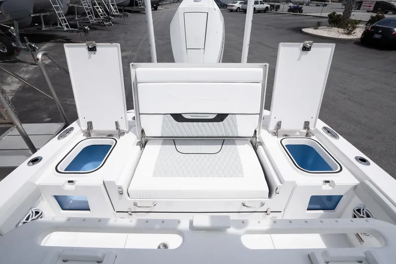 Slide: The Image of 2026 Blackfin 262 HB boat interior with open storage compartments and seating. - 9