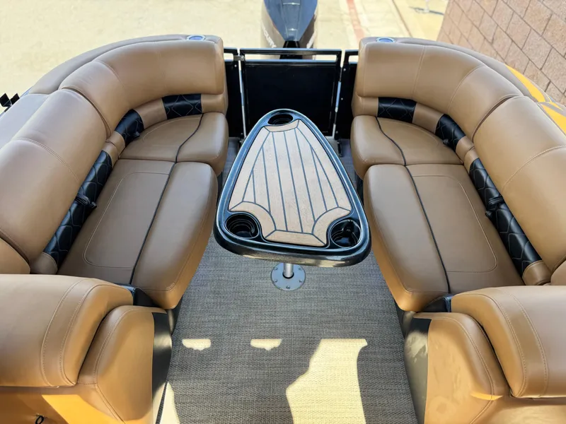 Slide: The Image of Luxurious 2021 Regency 230 LE3 boat interior with tan leather seating and stylish table. - 17