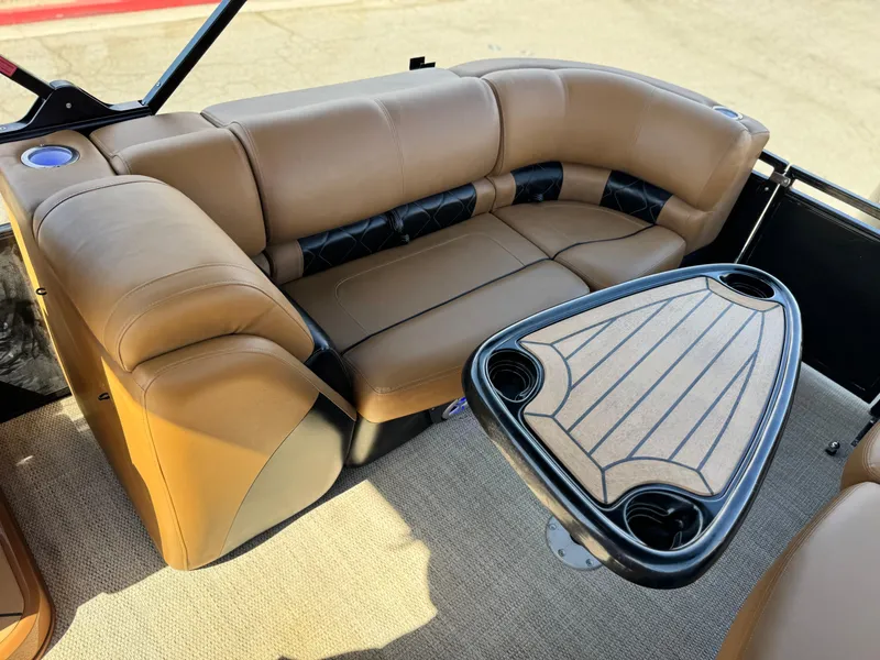 Slide: The Image of Luxurious seating area on 2021 Regency 230 LE3 pontoon boat with stylish table. - 18