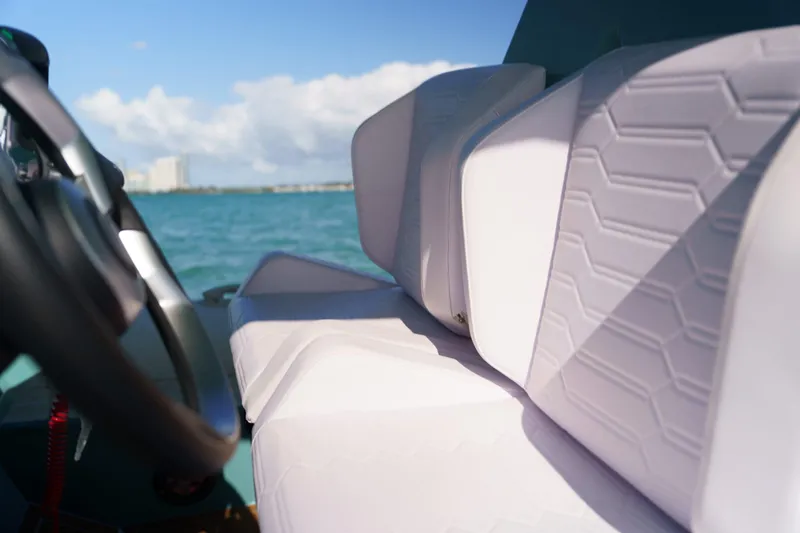 Slide: The Image of Interior of 2025 Novielli Veloche boat with white hexagonal-patterned seats and ocean view. - 16