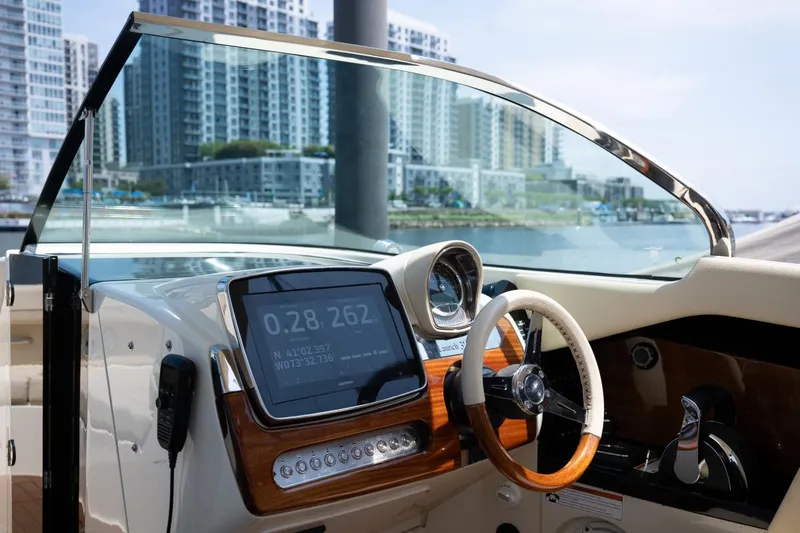 Slide: The Image of 2021 Chris-Craft Launch GT boat interior with cityscape background. - 13