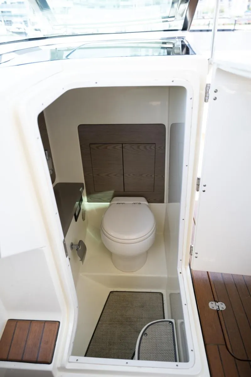 Slide: The Image of 2021 Chris-Craft Launch GT boat interior with compact bathroom and toilet. - 28