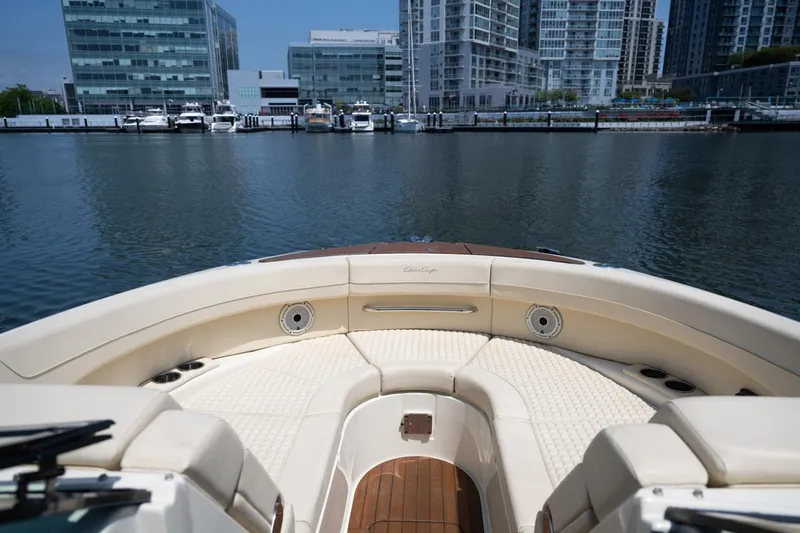 Slide: The Image of 2021 Chris-Craft Launch GT boat interior with waterfront cityscape background. - 32