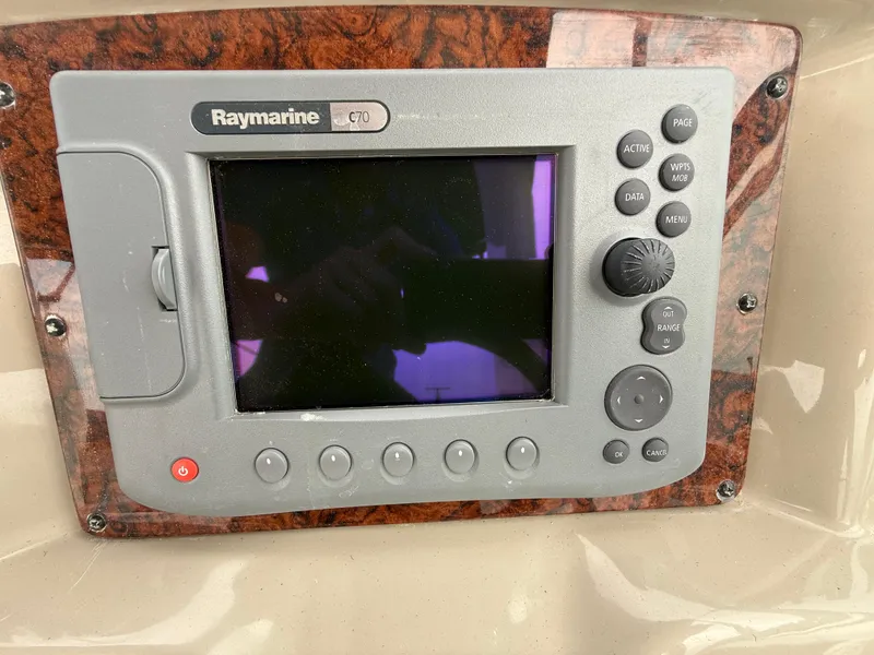 Slide: The Image of Raymarine GPS system on 2006 Sea Ray 300 Sundancer boat dashboard. - 11