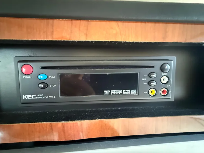 Slide: The Image of KEC DVD player in 2006 Sea Ray 300 Sundancer boat interior. - 31