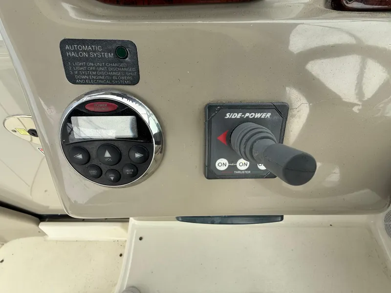 Slide: The Image of Control panel of a 2006 Sea Ray 300 Sundancer boat with joystick and buttons. - 37