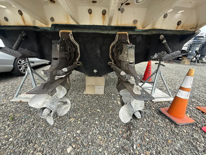 Slide: The Image of 2006 Sea Ray 300 Sundancer boat propellers on dry dock with traffic cones nearby. - 47
