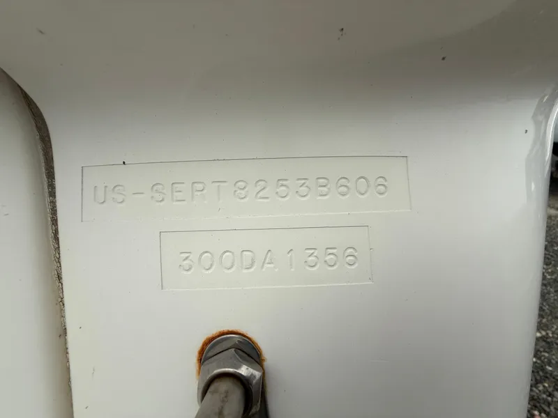 Slide: The Image of Hull identification number on a 2006 Sea Ray 300 Sundancer boat. - 49