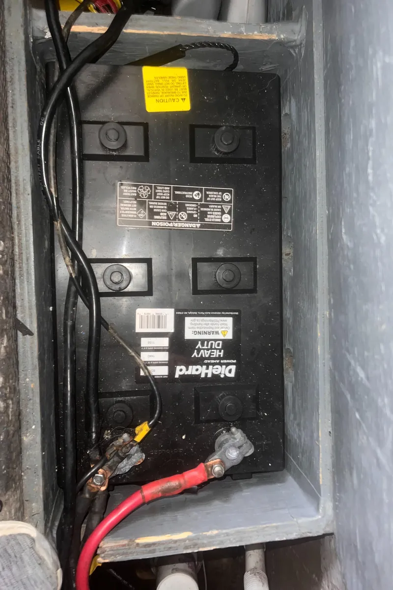 Slide: The Image of Battery compartment of a 1990 Luhrs 3400 Motor Yacht with DieHard heavy-duty battery. - 27