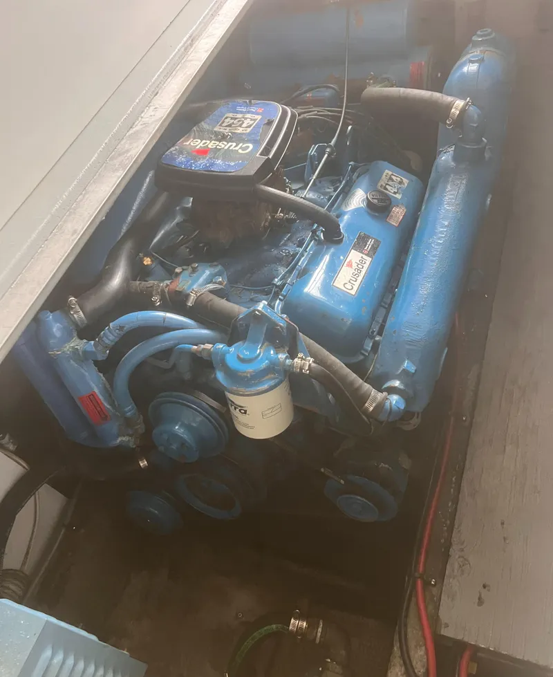 Slide: The Image of 1990 Luhrs 3400 Motor Yacht engine compartment with blue marine engine. - 29