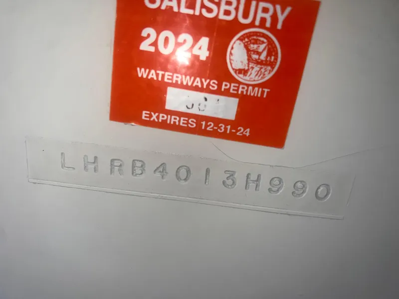 Slide: The Image of 1990 Luhrs 3400 Motor Yacht with 2024 Salisbury waterways permit and hull identification number. - 31