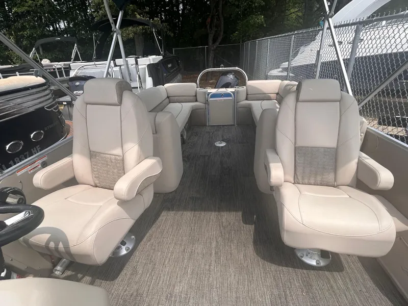 Slide: The Image of 2023 Avalon 2585 boat interior with beige seating and spacious layout. - 9