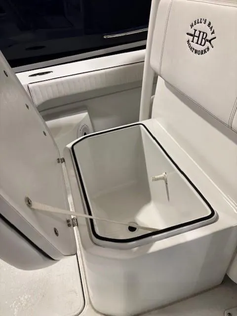Slide: The Image of 2018 Hell's Bay Estero 24 boat seat with built-in storage compartment. - 13