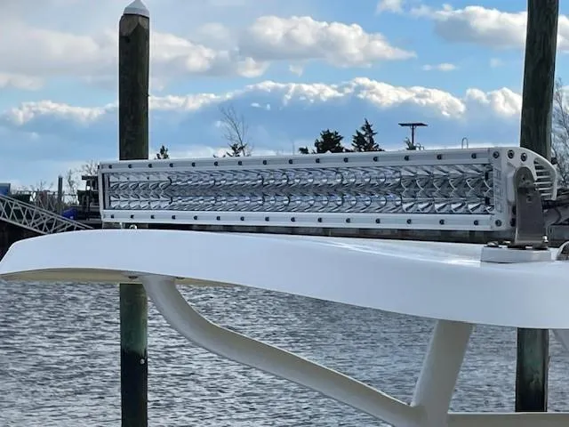 Slide: The Image of LED light bar on 2018 Hell's Bay Estero 24 boat, docked by the water. - 6