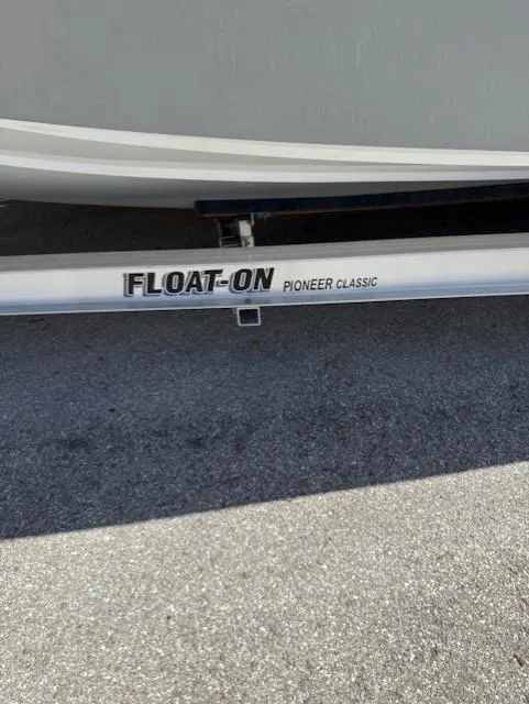Slide: The Image of 2024 Bluewater 23 boat on Float-On Pioneer Classic trailer. - 4