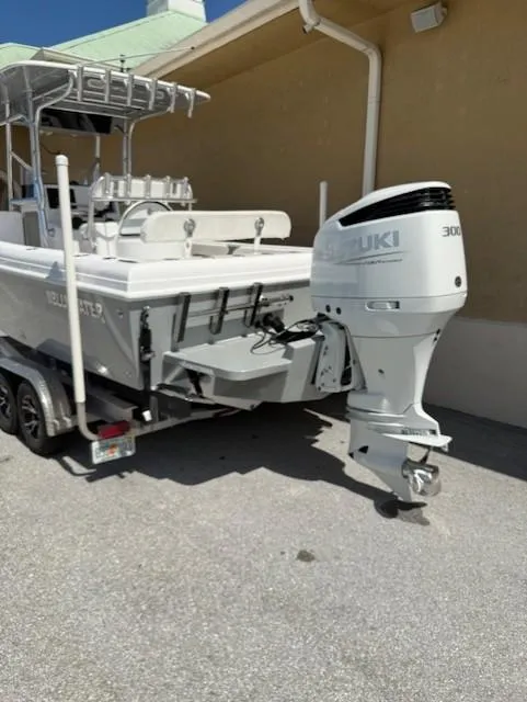 Slide: The Image of 2024 Bluewater 23 boat with Suzuki 300 outboard motor on trailer. - 5