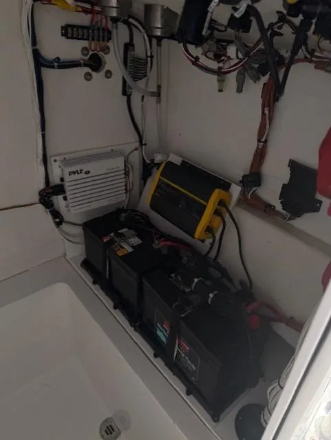 Slide: The Image of Electrical system of a 2024 Bluewater 23 boat, featuring batteries and wiring. - 6