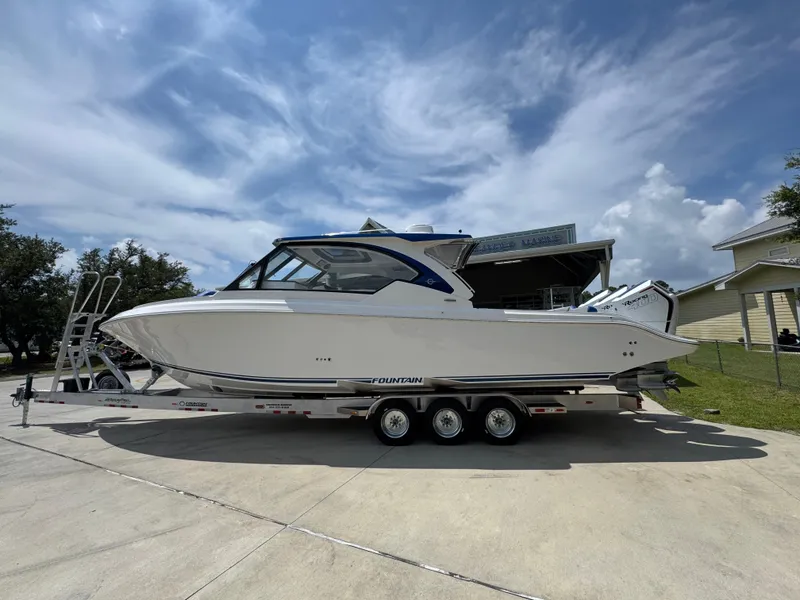Slide: The Image of 2026 Fountain 39 DX boat on trailer under cloudy sky. - 20