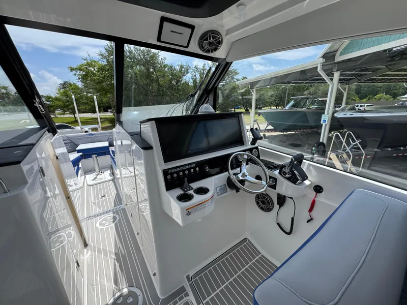 Slide: The Image of Interior of 2026 Fountain 39 DX boat with modern helm and navigation equipment. - 26