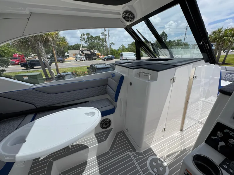 Slide: The Image of Interior of 2026 Fountain 39 DX boat with seating and table, showcasing modern design. - 29