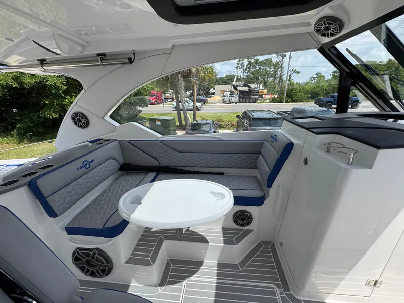 Slide: The Image of 2026 Fountain 39 DX boat interior with seating, table, and modern design elements. - 30