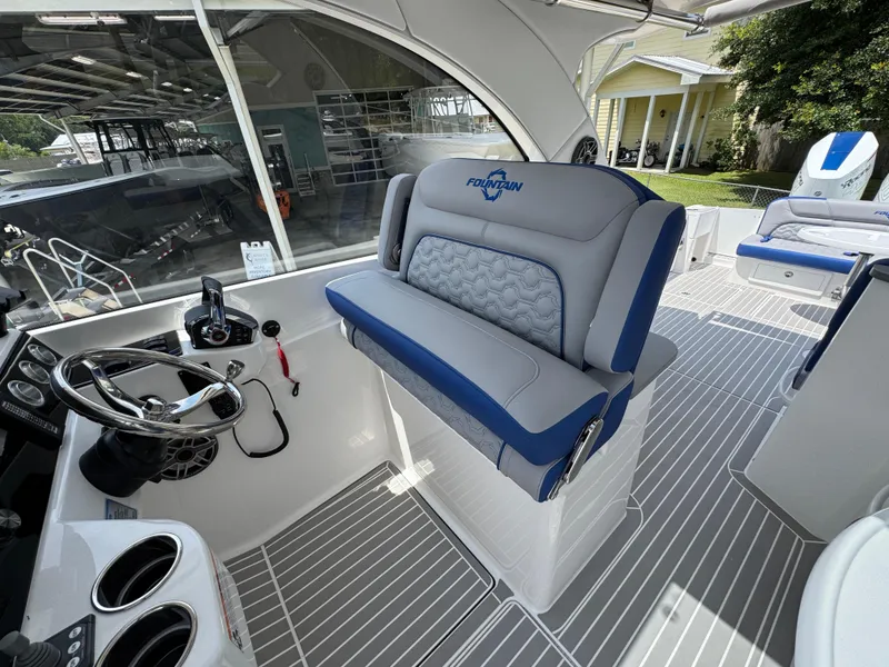Slide: The Image of 2026 Fountain 39 DX boat interior with modern helm and seating. - 31