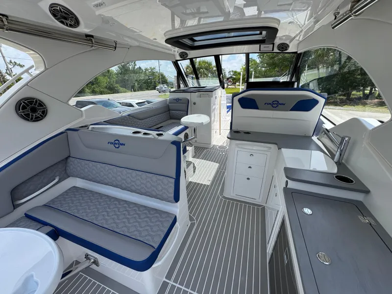 Slide: The Image of Interior of 2026 Fountain 39 DX boat with modern seating and sleek design. - 36