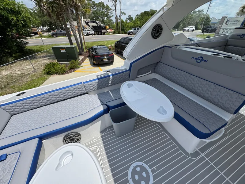 Slide: The Image of 2026 Fountain 39 DX boat interior with gray seating, white tables, and modern design. - 37